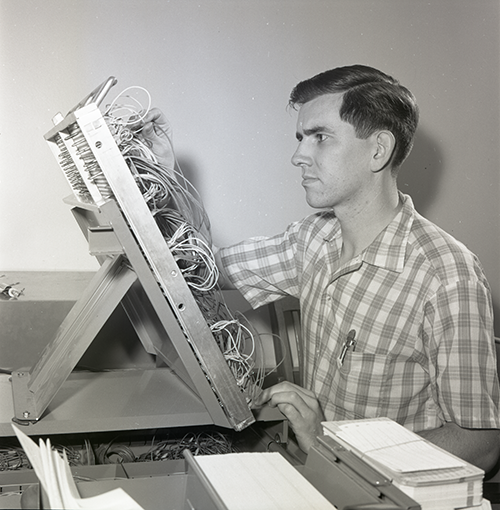 A student uses UM's first computer lab in the 1960s.