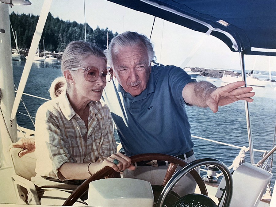 Judith Morgan and Walter Cronkite sail off the coast of Maine, 1994.
