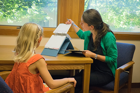 A psychologist works with a child at the Clinical Psychology Center.