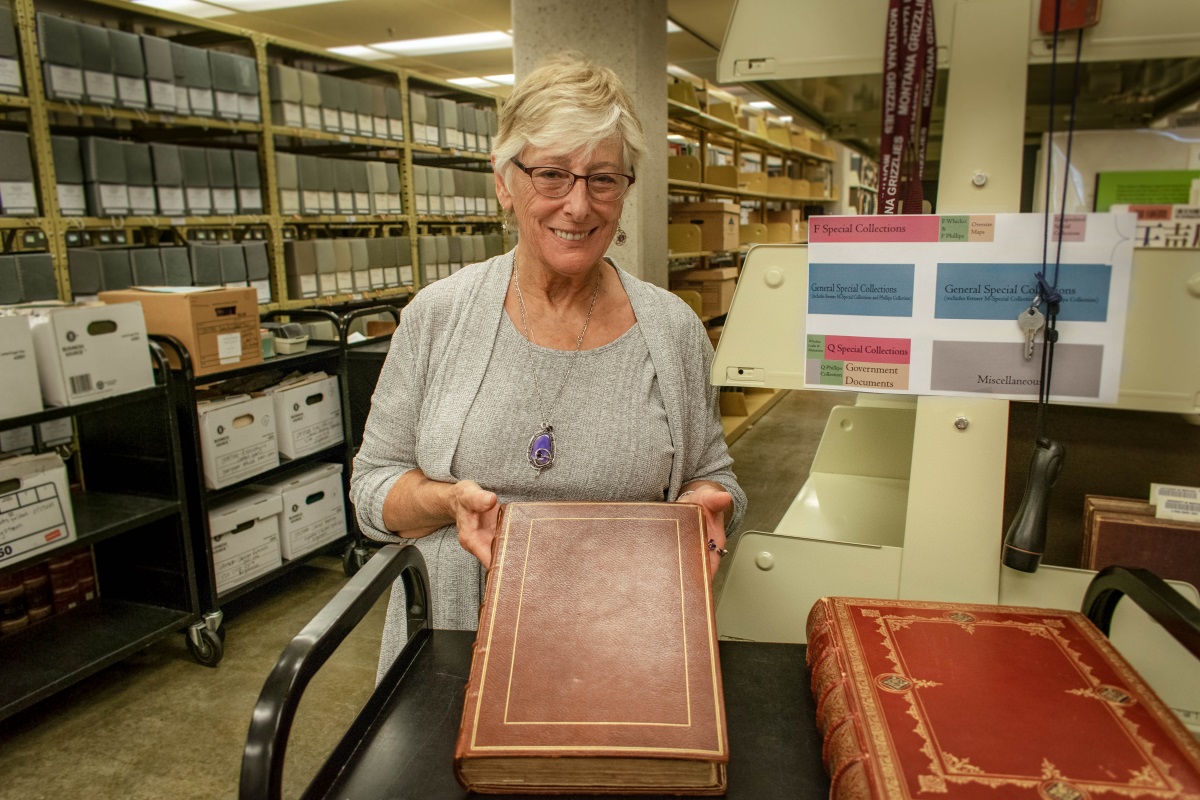 During a tour of the Archives and Special Collections at the Maureen and Mike Mansfield Library, Mary Doherty, Trustee for the Richard L. Merritt Trust, stops to admire The Woorkes of Geffrey Chaucer. This 1561 edition by John Stow is the oldest book in the Mansfield Library and was donated by Merritt in 1984.